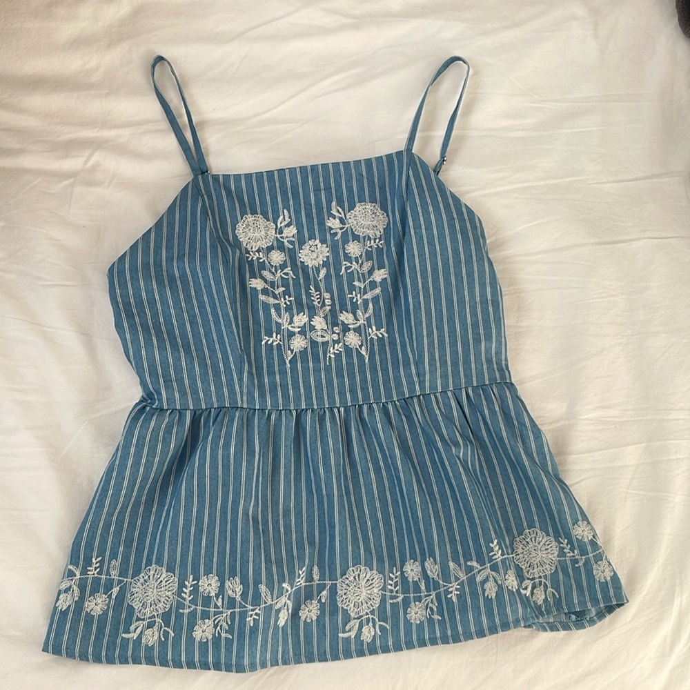 Francesca’s light blue and white top